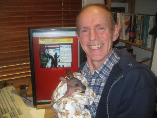 Mike Linacre with Robbi the wallaby joey